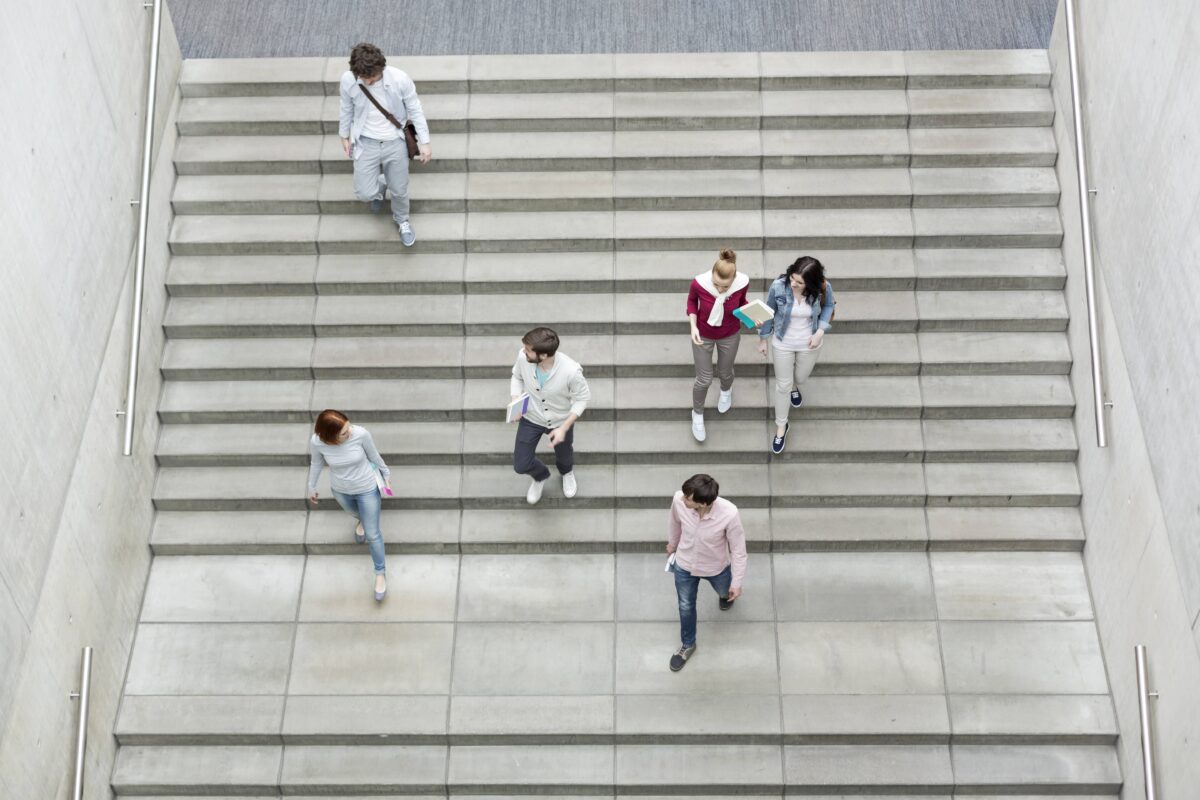 Group of students walking on stairs